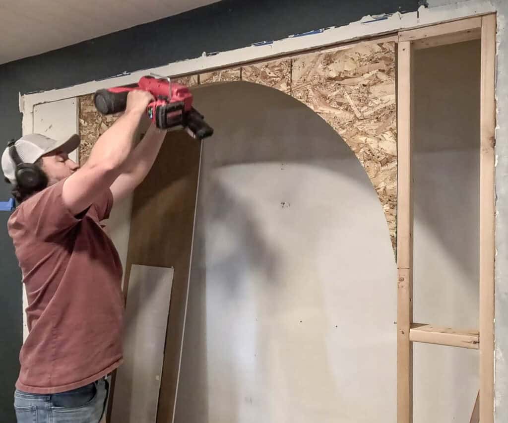 Attaching OSB sheet with arch cut out of it to 2x4 framing for an arched opening with a framing nailer