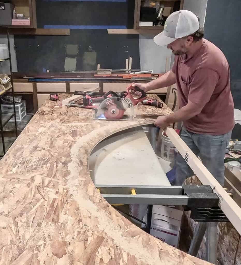Cutting down OSB with circular saw to make framing for arched doorway