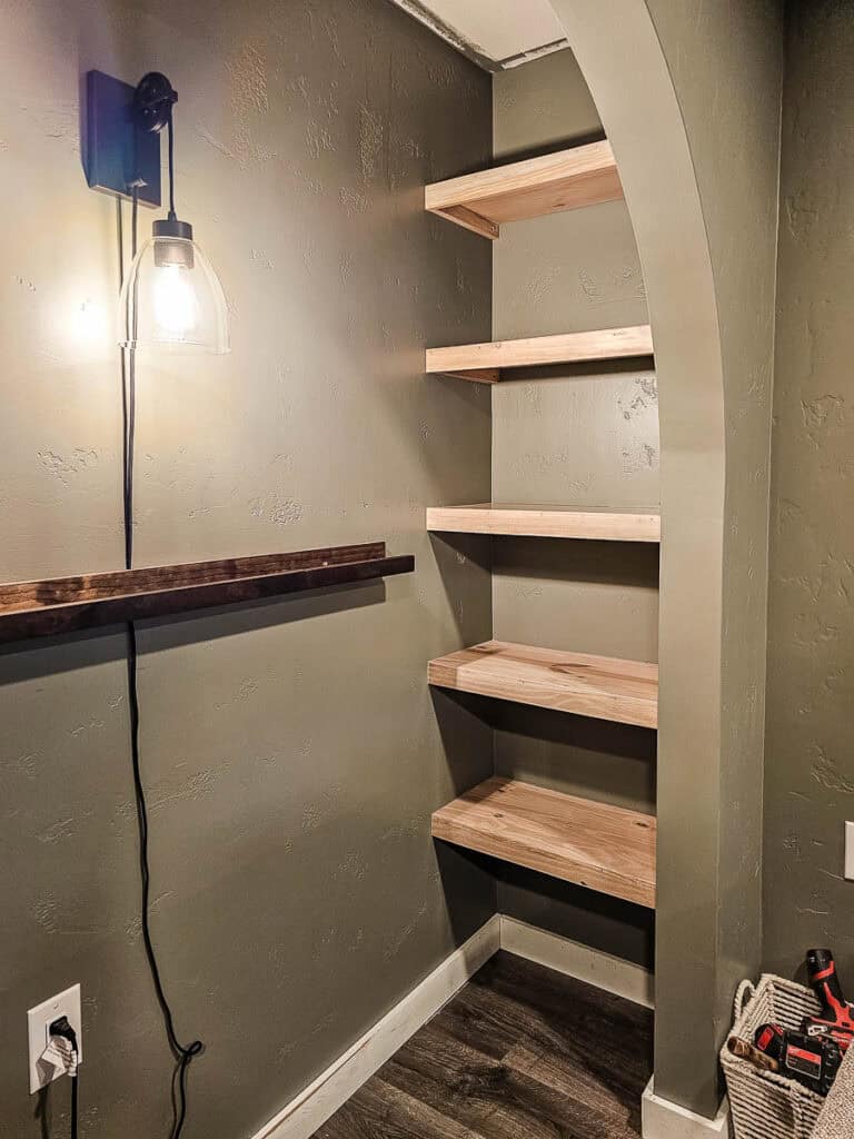 Reading nook in progress with empty bookshelves before it was filled