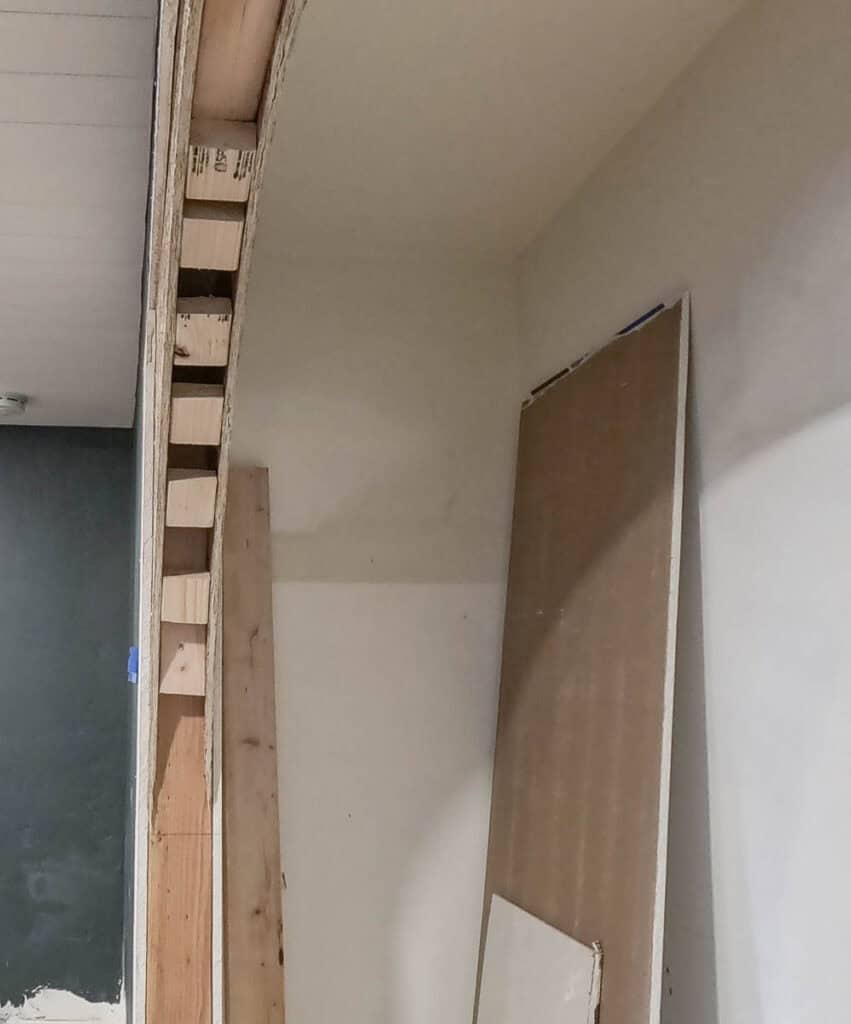 Side angle of framing for arched opening with 2x3 blocks in between two sheets of OSB 