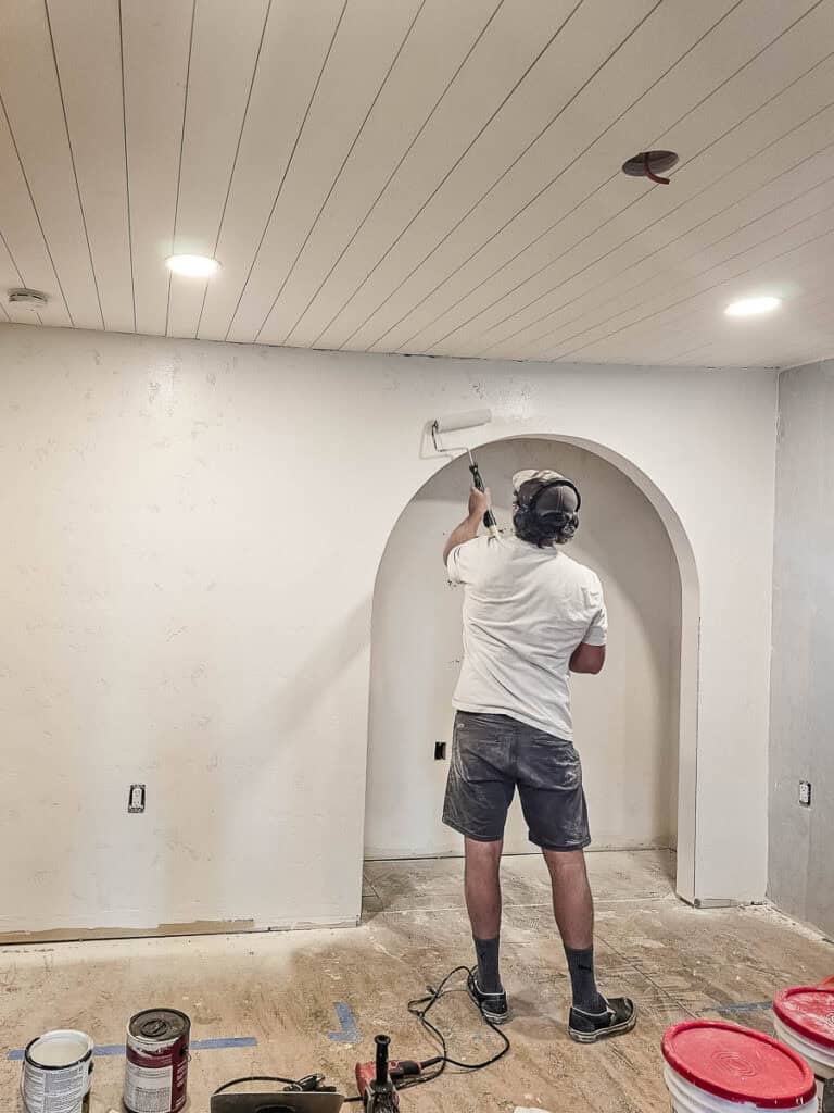 Priming archway and wall during renovation project