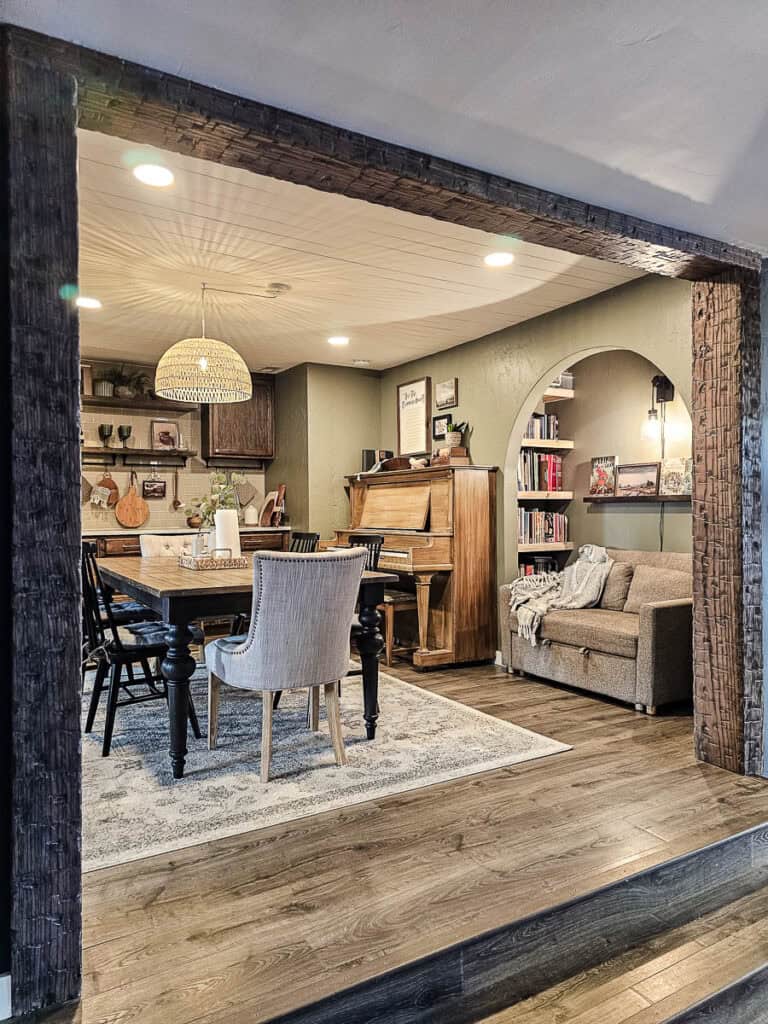 An area rug under the table in a traditional-style dining room.