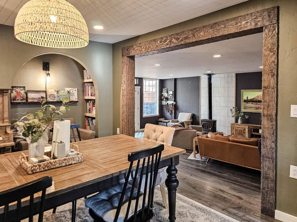 Fake wood beams in dining room and living room open concept that look old and authentic 