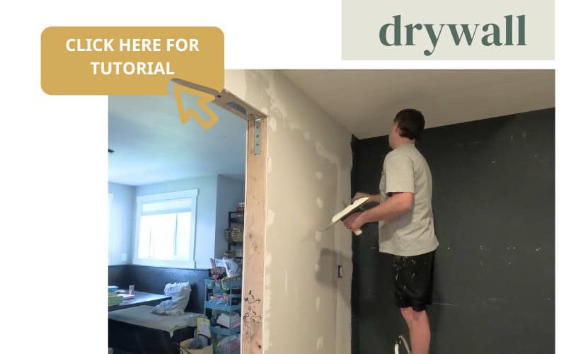 A photo of a man installing and texturing drywall.
