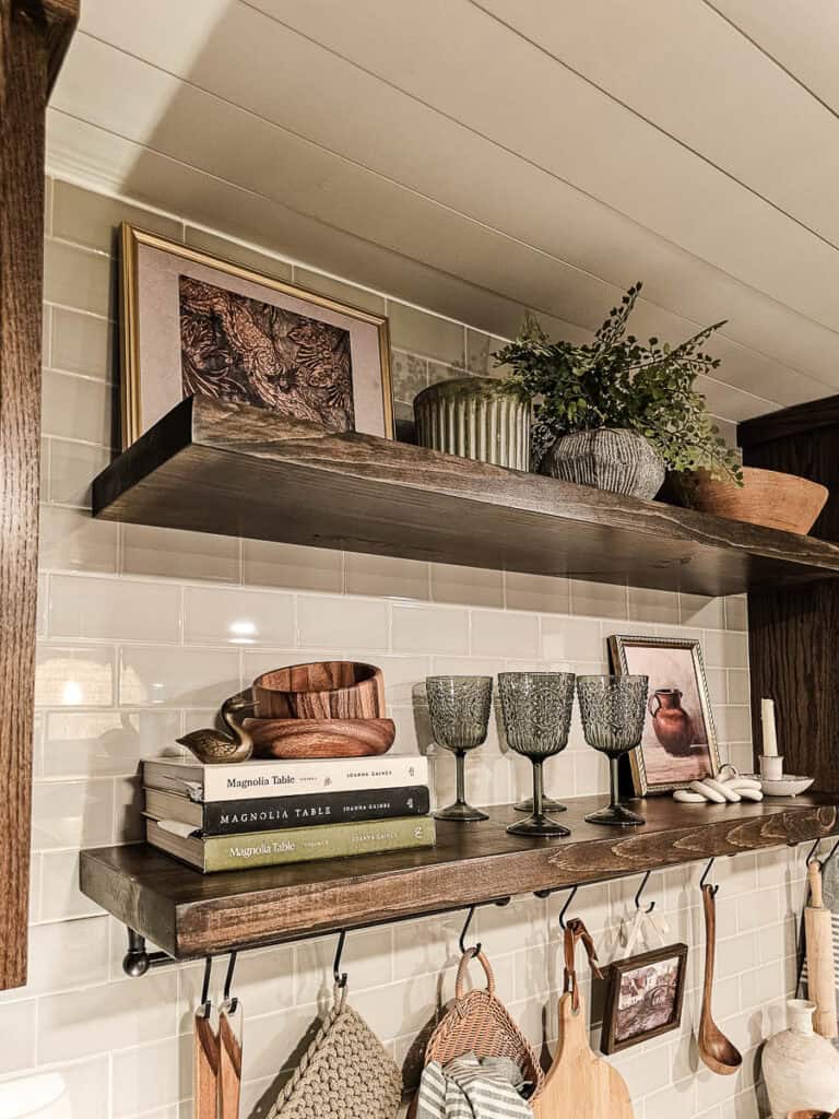 A close-up photo of a tiled wall with built-in cabinetry and shelving.