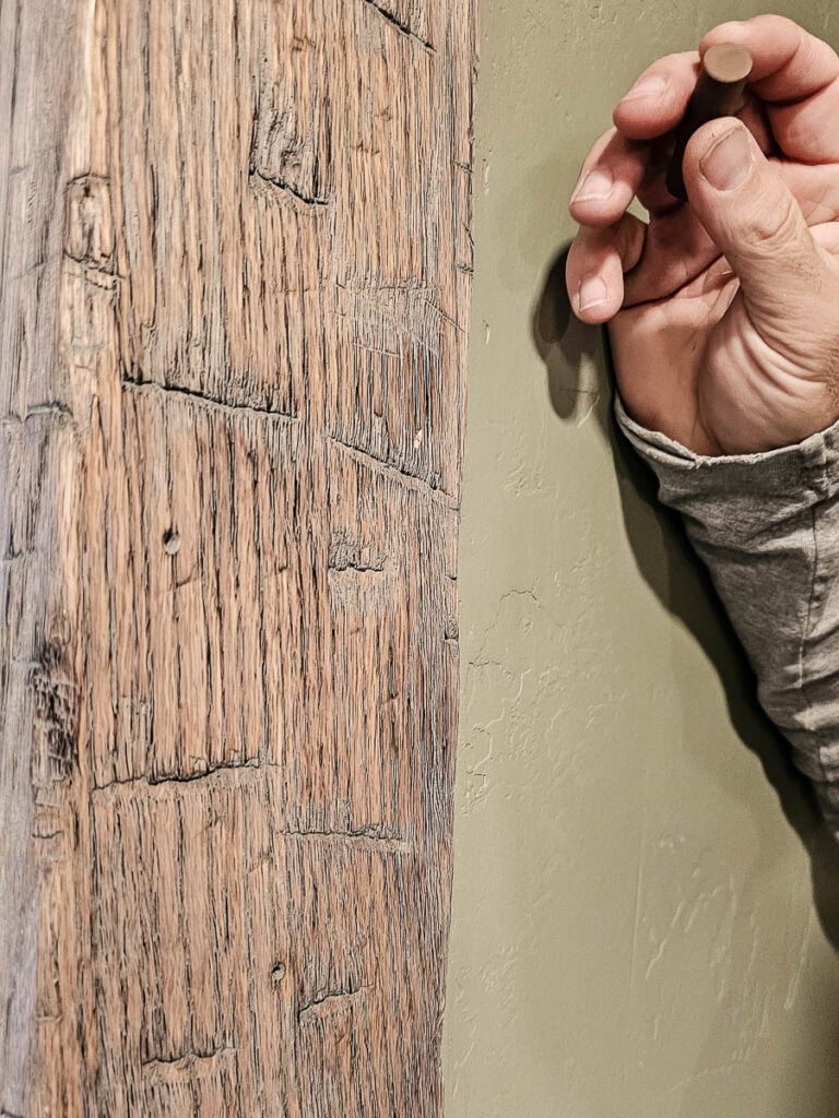 Nail hole in faux wood beam that needs to be filled