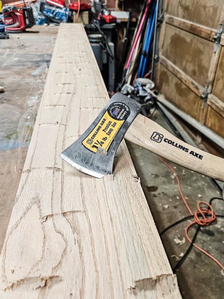 A photo of a Chop wood with a hatchet