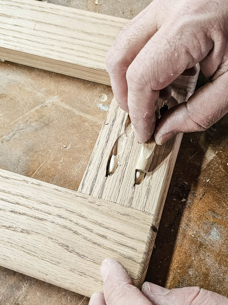 A photo of installing pocket hole plugs.