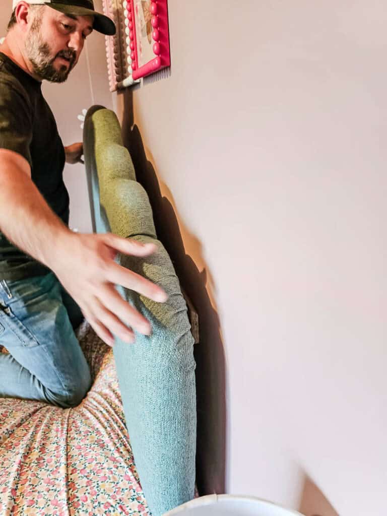 The French cleat is used to hang up the diy upholstered headboard on the wall behind the bed 