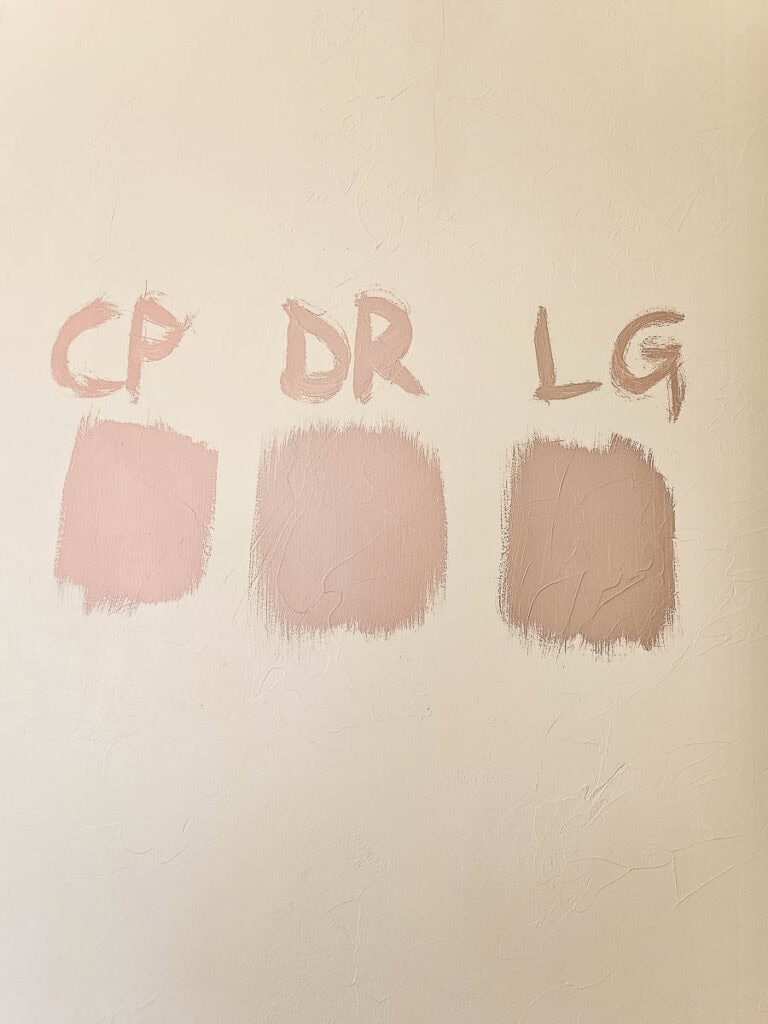 Three shades of peach on the wall.