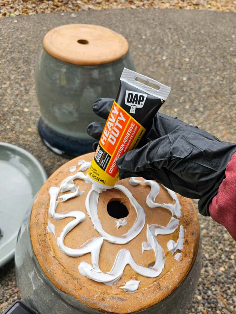 Photo of a patio surface being applied with adhesive glue.
