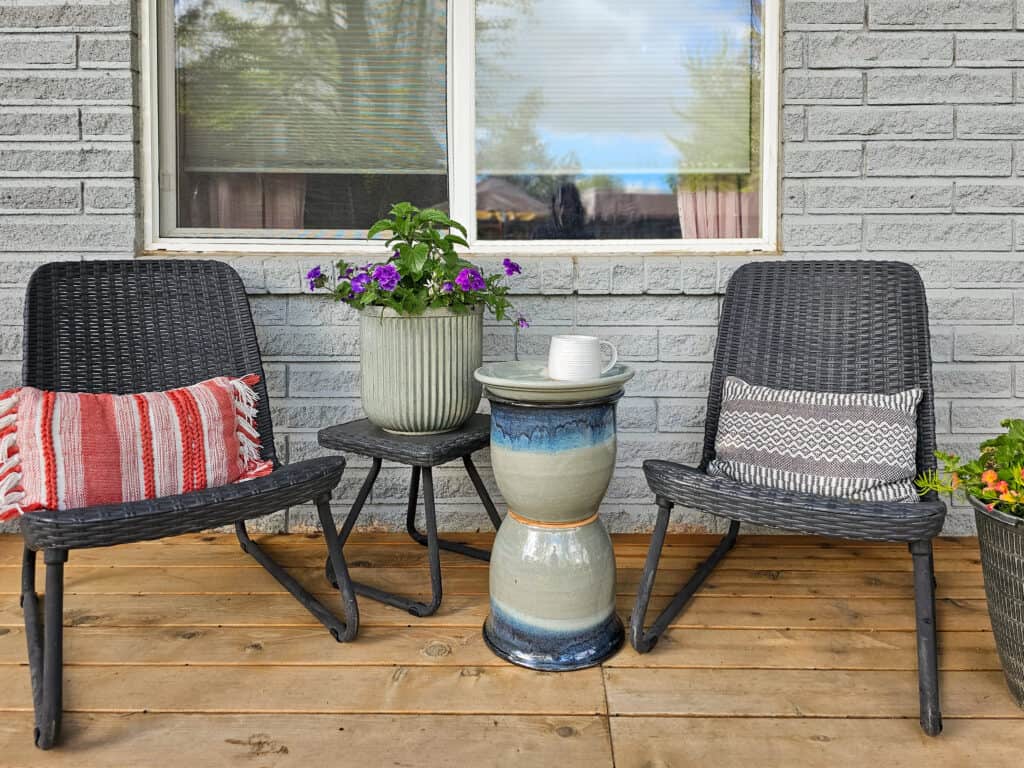 Close-up angle of a DIY patio side table on a porch, styled for outdoor relaxation.