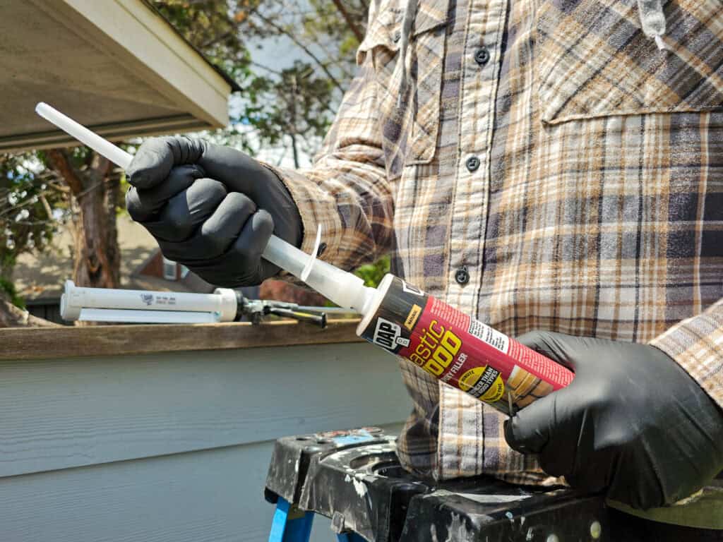 man preparing epoxy filler